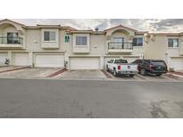 Two-story townhouses with attached garages and parking at 6201 E Lake Mead Blvd # 238, Las Vegas, NV 89156