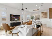 Bright living room with modern furniture and city views at 671 Sentinel Spire St, Las Vegas, NV 89138