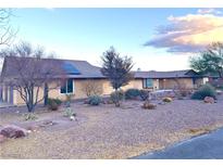 Ranch style home featuring desert landscaping, a simple brown roof, and a welcoming exterior at 7415 Constantinople Ave, Las Vegas, NV 89129