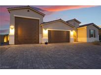 Beautiful two-story home with a three-car garage and landscaped front yard at 8750 Lutts St, Las Vegas, NV 89131