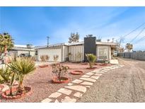 Ranch style home with landscaped yard and attached two-car garage at 108 S Mallard St, Las Vegas, NV 89107