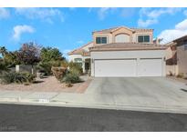 Charming two-story home features a three-car garage and well-maintained landscaping at 1812 Dalton Dr, Henderson, NV 89014