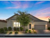 Single-story home with neutral siding, landscaped yard, and a two-car garage at 2364 Boretto St, Henderson, NV 89044