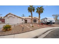 Single-story home with desert landscaping and RV parking at 4527 Buddy Holly Ct, North Las Vegas, NV 89031