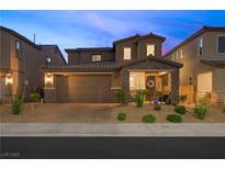 Charming two-story home featuring a well-manicured front yard and an attached two-car garage at 7073 Range Valley St, North Las Vegas, NV 89084