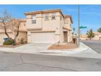 Two-story house with attached garage, landscaping, and a corner lot at 7732 Prosperity River Ave, Las Vegas, NV 89129