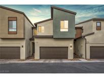 Modern townhouse exterior with attached garage and neutral color palette at 9289 Casa Sierra Ln, Las Vegas, NV 89148