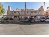 Two-story building with covered parking and landscaped grounds at 1375 E Hacienda Ave # 201, Las Vegas, NV 89119