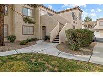 Well-maintained building exterior with stairs and landscaping at 1851 Hillpointe Rd # 2123, Henderson, NV 89074