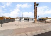 Newly renovated home with a fenced front yard and gravel landscaping at 214 W Atlantic Ave, Henderson, NV 89015