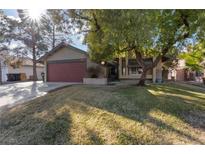 Single story house with attached garage and grassy front yard at 2353 Moorpark Way, Henderson, NV 89014