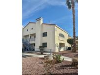 Two-story condo building with stairs and desert landscaping at 2725 S Nellis Blvd # 2036, Las Vegas, NV 89121