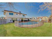 Inviting backyard with sparkling pool and grassy area at 4008 Snead Dr, Las Vegas, NV 89107