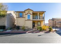 Two-story house with balcony, landscaping, and driveway at 4530 Lime Straight Dr, Las Vegas, NV 89115