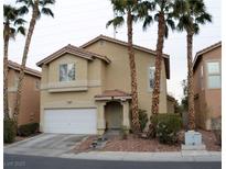 Two-story house with attached garage and landscaping at 7566 Luna Del Rey St, Las Vegas, NV 89123