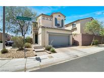 Two-story house with gray garage door and landscaped yard at 8261 Peaceful Mountain Ave, Las Vegas, NV 89178