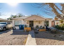 Ranch style home with a gravel front yard, covered porch, and mature tree at 2116 Poplar Ave, Las Vegas, NV 89101