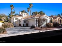 Beautiful two-story house with a two-car garage and landscaped front yard at 2536 Golden Sands Dr, Las Vegas, NV 89128