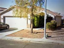 One-story house with attached garage and desert landscaping at 2935 Kensington St, Las Vegas, NV 89156