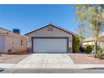 Charming single-story home with a two-car garage, desert landscaping, and neutral color palette at 2935 Kensington St, Las Vegas, NV 89156