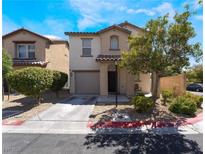 Two-story house with attached garage and landscaping at 4204 Becket Ct, Las Vegas, NV 89129