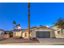 Charming single-story home featuring a two-car garage and desert landscaping at 5117 Dancer Way, Las Vegas, NV 89107