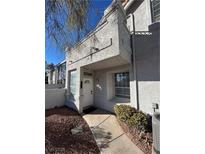 Well-maintained stucco home with walkway and landscaping at 5201 S Torrey Pines Dr # 1244, Las Vegas, NV 89118