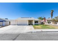 Single story home with attached garage and landscaped lawn at 7037 Pleasant View Ave, Las Vegas, NV 89147