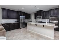 Spacious kitchen with stainless steel appliances and granite countertops at 1015 Solana Crest St, Henderson, NV 89052