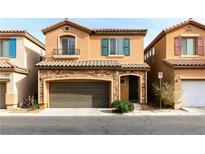 Two-story house with attached garage and stone accents at 10588 El Cerrito Chico St, Las Vegas, NV 89179