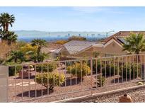 Landscaped backyard with desert plants and mountain views at 10921 Grand Haven Ave, Las Vegas, NV 89134