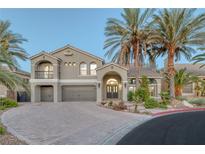 Two-story house with gray exterior, three-car garage, and palm trees at 11158 Antonine Wall Ct, Las Vegas, NV 89141