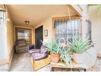 Inviting front patio with seating and potted plants at 2256 Sabroso St, Las Vegas, NV 89156