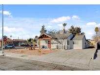 Newly renovated single story home with a covered porch and landscaped yard at 240 S 16Th St, Las Vegas, NV 89101