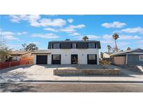 Remodeled two-story house with a modern facade and landscaped yard at 705 N Torrey Pines Dr, Las Vegas, NV 89107