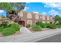 Exterior view of a light brown building with landscaping and walkway at 7950 W Flamingo Rd # 1041, Las Vegas, NV 89147