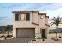 Two-story house with gray garage door and landscaping at 8969 Faxom St, Las Vegas, NV 89166