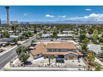 Expansive two-story house showcases mountain views and desert landscaping in the front yard at 1420 S 8Th St, Las Vegas, NV 89104