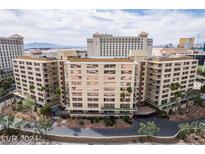 Aerial view of a condominium complex, showcasing its building and surrounding landscape at 205 E Harmon Ave # 409, Las Vegas, NV 89169
