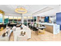 Spacious living area with city views and modern furniture at 4525 Dean Martin Dr # 2406, Las Vegas, NV 89103