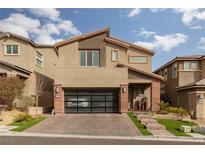 Two-story home with modern facade and landscaped yard at 10936 White Alder Pl, Las Vegas, NV 89138