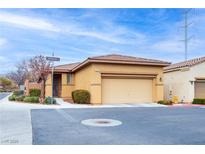 Charming single-story home with a well-maintained front yard on a sunny day at 7611 Redcloud Peak St, Las Vegas, NV 89166