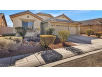 Beautiful desert home with three-car garage and well-manicured landscaping at 3041 Bublin Bay Ave, North Las Vegas, NV 89081