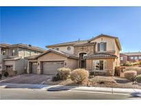 Two-story house with stone accents and a three-car garage at 7923 Sleeping Lily Dr, Las Vegas, NV 89178