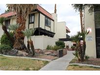Exterior view of a two-story building with Spanish-style architecture and landscaping at 1420 Vegas Valley Dr # 23, Las Vegas, NV 89169