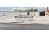 Wide shot of an Absolute Palliative Care building's exterior with ample parking space at 3127 S Eastern Ave, Las Vegas, NV 89169