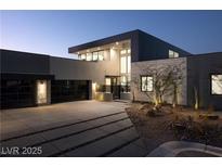 Modern home with sleek design, two-car garage, and landscaped grounds at 4377 Cameron Brook Ct, Las Vegas, NV 89129