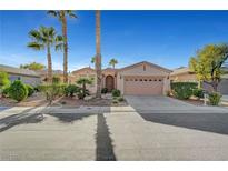 Single-story house with a two-car garage and desert landscaping at 4379 Bella Cascada St, Las Vegas, NV 89135