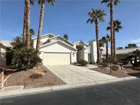Single-story house with a two-car garage and desert landscaping at 5416 Lochmor Ave, Las Vegas, NV 89130