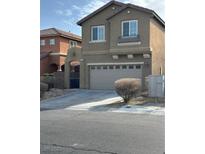 Two-story house with attached garage and landscaping at 9217 Placer Bullion Ave, Las Vegas, NV 89178